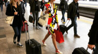 Moschino Invites 400 "Commuters" To Its SS27 Runway